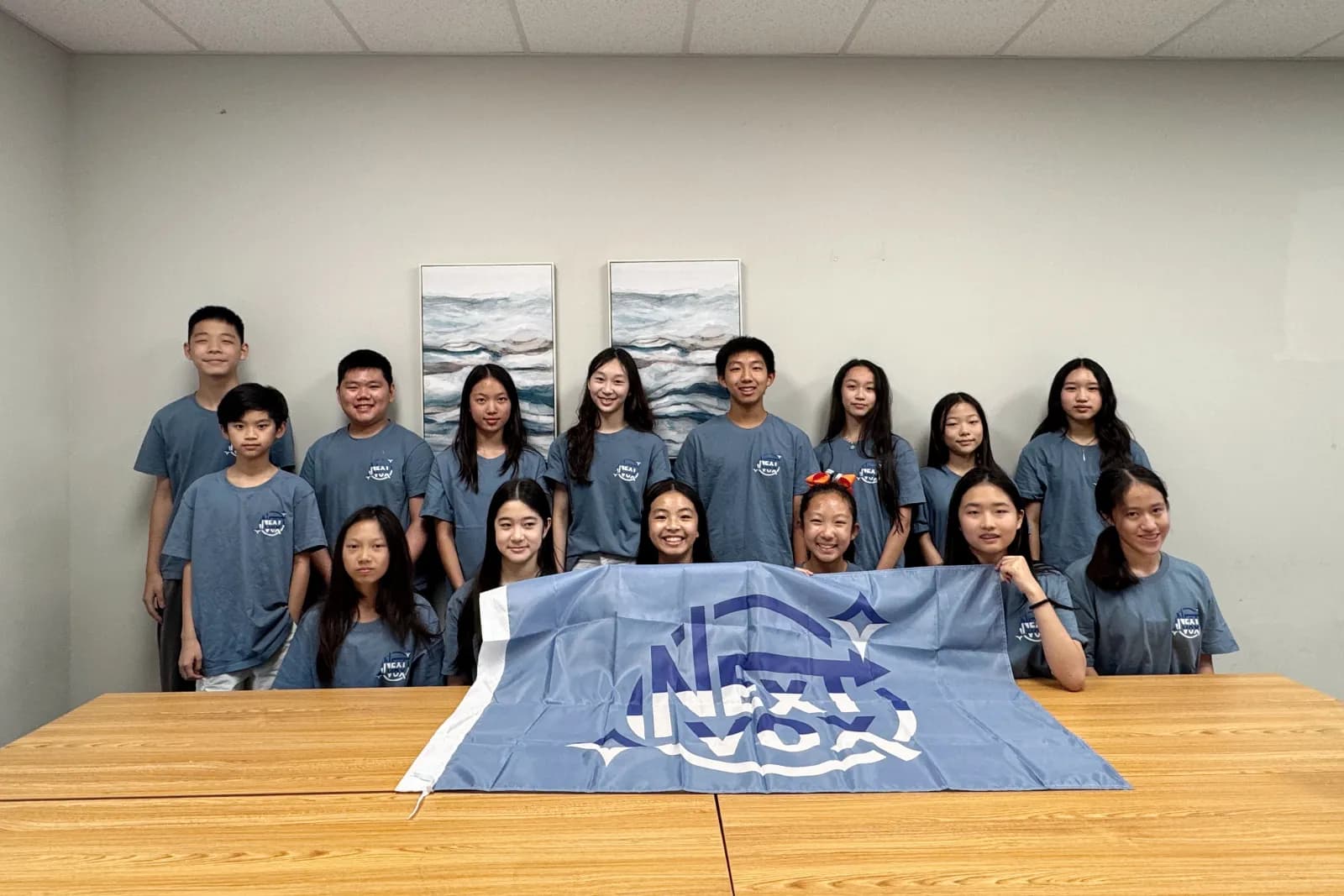 The NextVox team with the NextVox flag